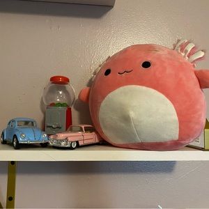 Cute pink Cadillac and blue Volkswagen bug